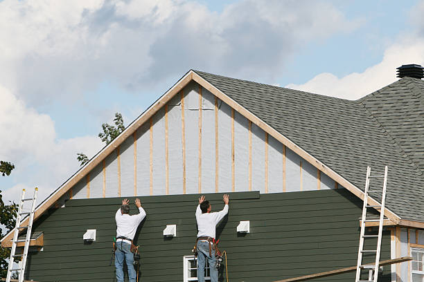 Professional Siding Installation technician working in Bellmore, NY